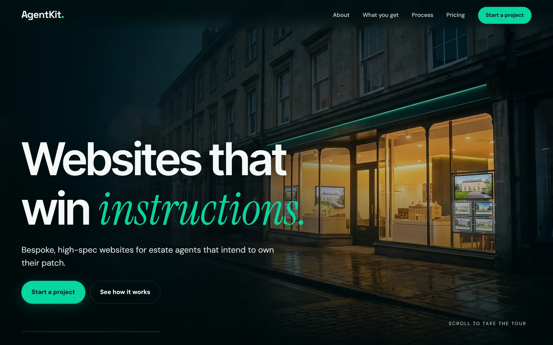 The AgentKit homepage: a lit shop front on a wet high street at dusk, under the headline Websites that win instructions.