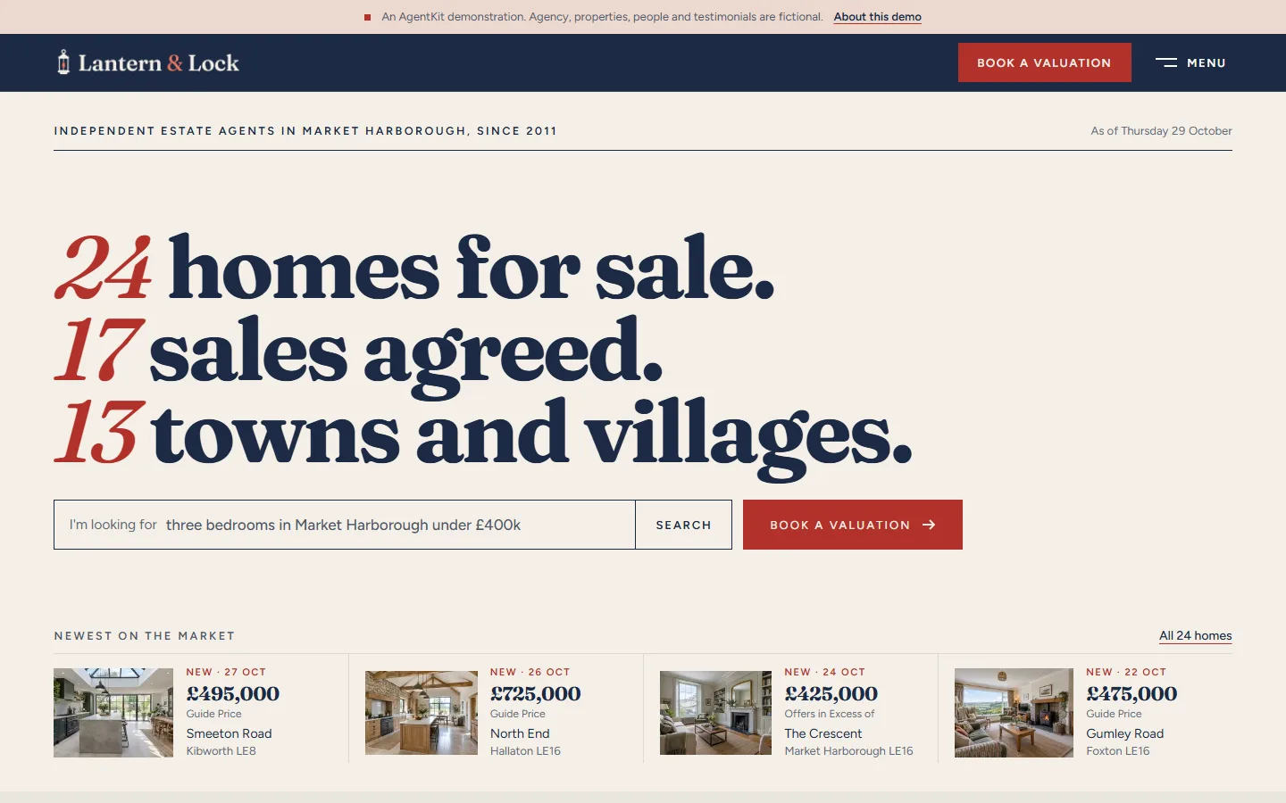 The Lantern & Lock home page: navy bar and cream paper, the headline 24 homes for sale, 17 sales agreed, 13 towns and villages, a sentence search and a red Book a valuation button, and the four newest homes beneath.